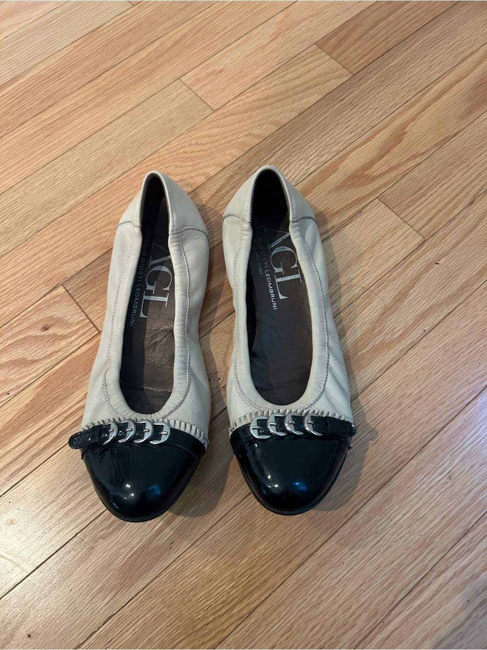 AGL Cream Leather Flats with Black Patent Cap Toes and Silver Detail